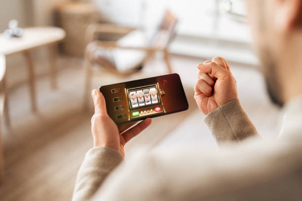 Mobile phone showing lorenzo slot account dashboard with balance and transaction history